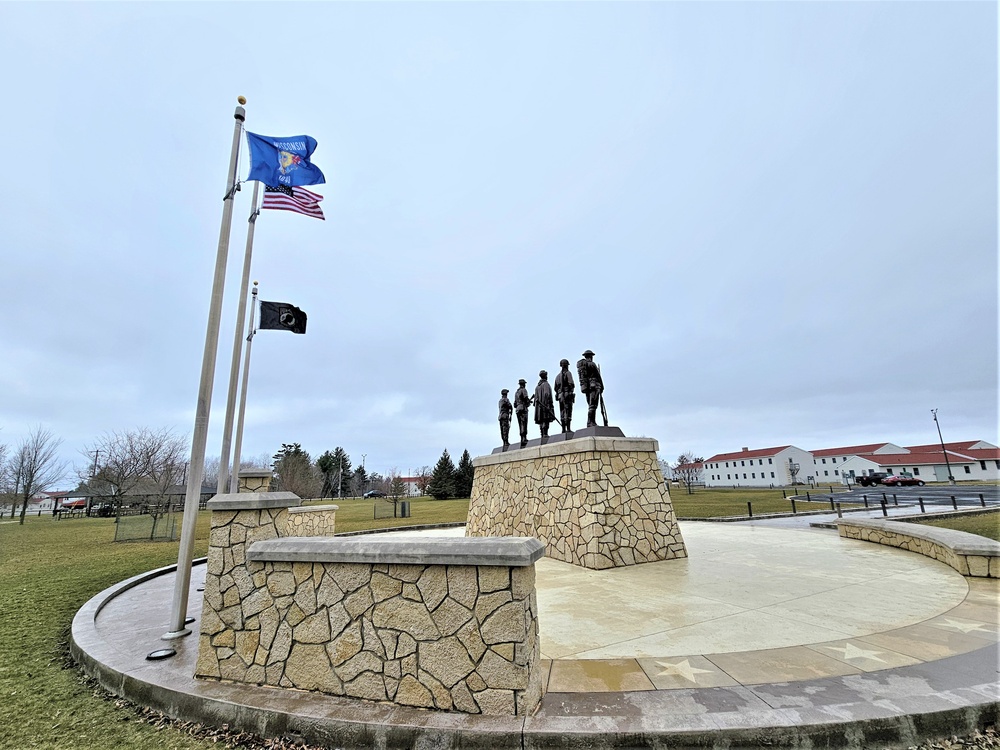 Raising flag at Fort McCoy's Veterans Memorial Plaza