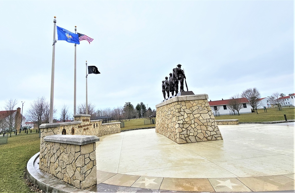 Raising flag at Fort McCoy's Veterans Memorial Plaza