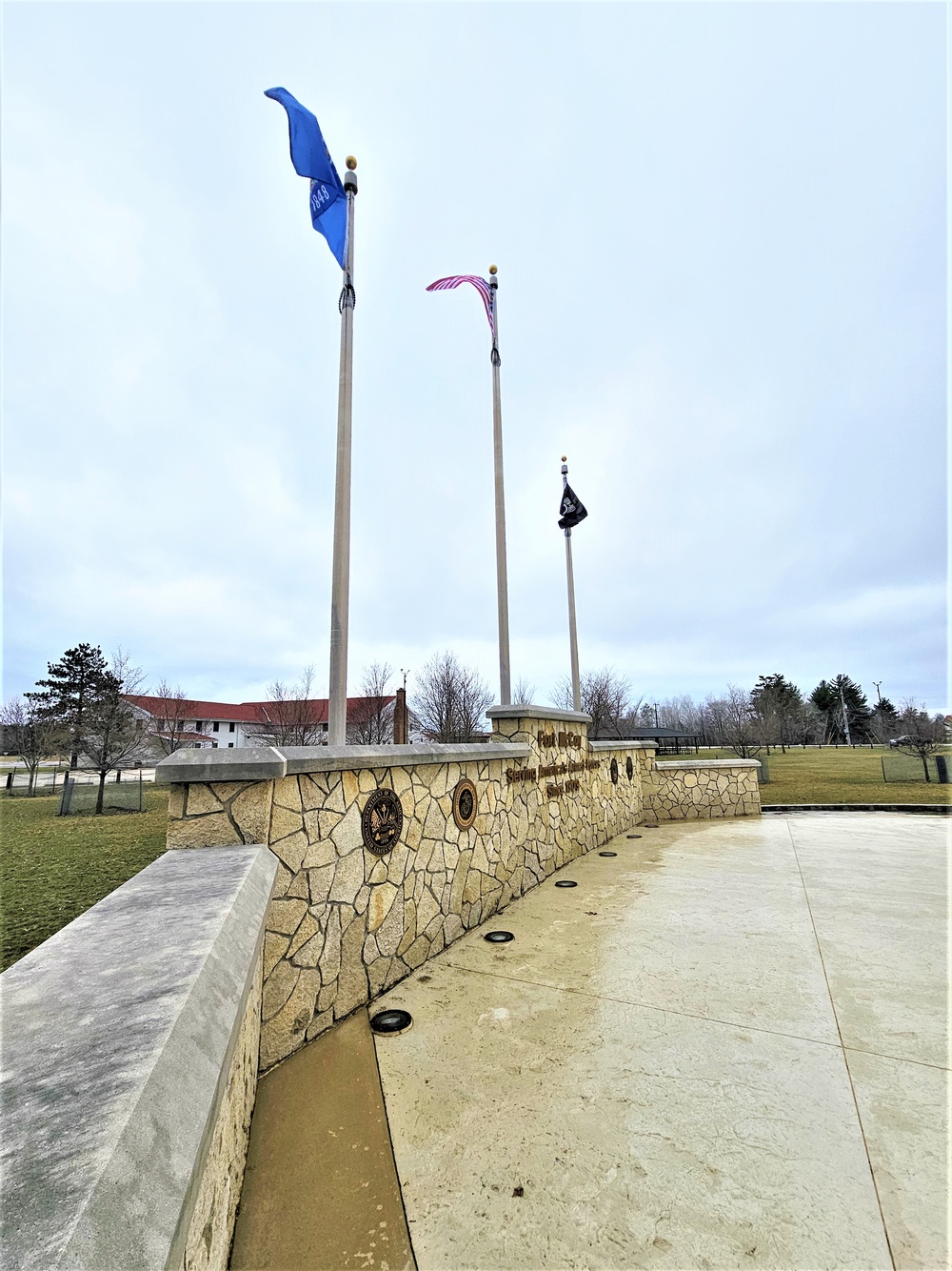 Raising flag at Fort McCoy's Veterans Memorial Plaza