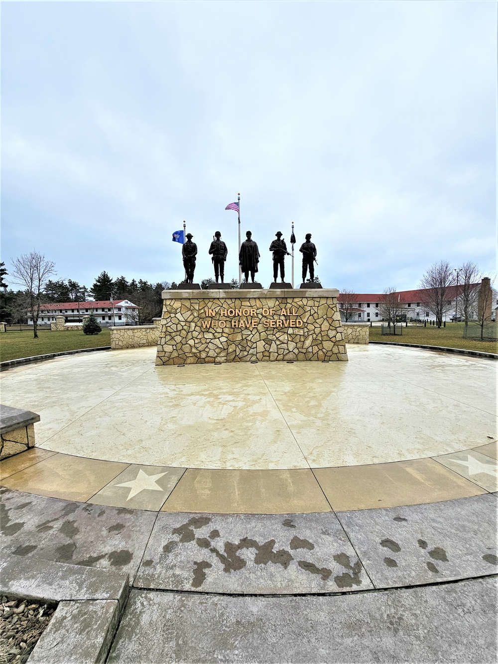 Raising flag at Fort McCoy's Veterans Memorial Plaza