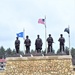 Raising flag at Fort McCoy's Veterans Memorial Plaza