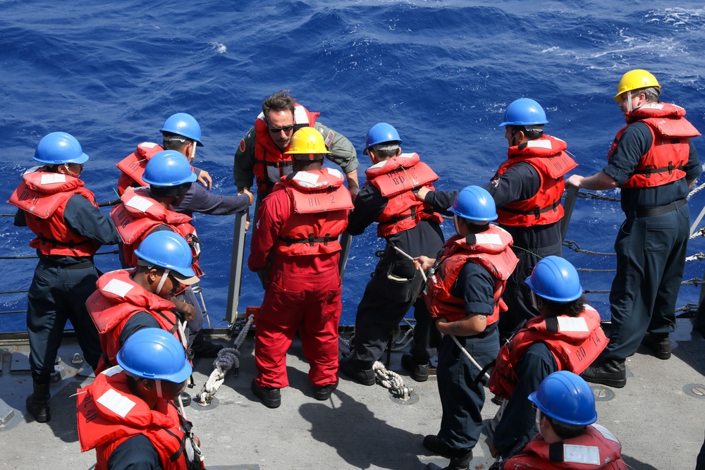 Sailors aboard the USS Howard conduct a boat operation in the Philippine Sea