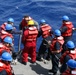 Sailors aboard the USS Howard conduct a boat operation in the Philippine Sea