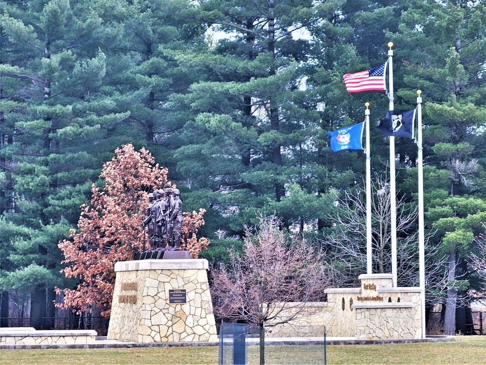 Raising flag at Fort McCoy's Veterans Memorial Plaza