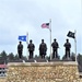 Raising flag at Fort McCoy's Veterans Memorial Plaza
