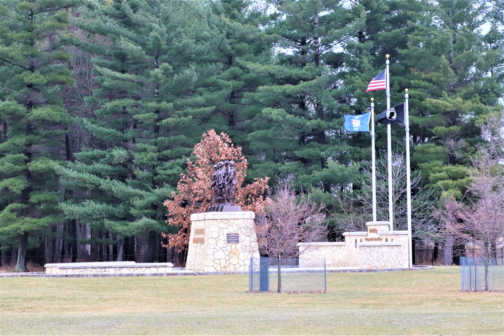 Raising flag at Fort McCoy's Veterans Memorial Plaza