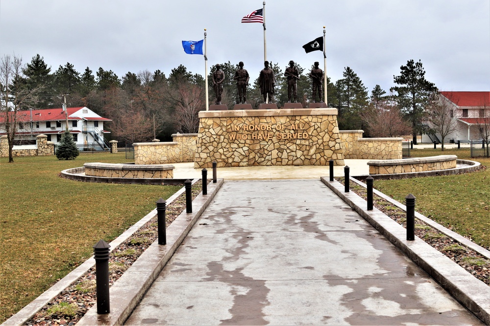 Raising flag at Fort McCoy's Veterans Memorial Plaza