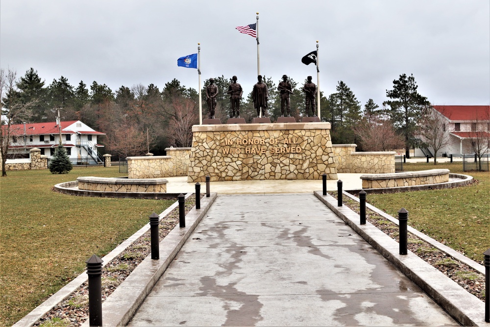 Raising flag at Fort McCoy's Veterans Memorial Plaza
