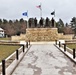 Raising flag at Fort McCoy's Veterans Memorial Plaza