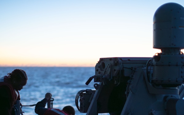 Gunner’s Mates prepare and fire MK-38 25mm gun.