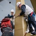 USS Ronald Reagan (CVN 76) Sailor re-enlists on the anchor