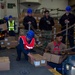 USS Ronald Reagan (CVN 76) Sailors move cargo