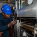 USS Ronald Reagan (CVN 76) Sailors perform maintenance on steam convection oven