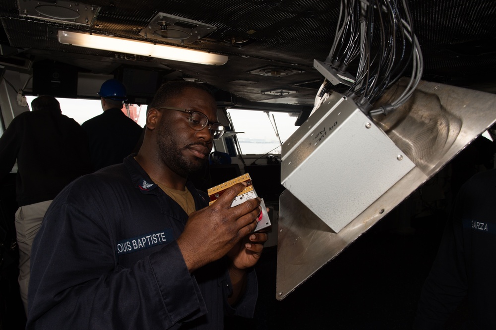 USS Ronald Reagan (CVN 76) Sailors troubleshoot bridge systems