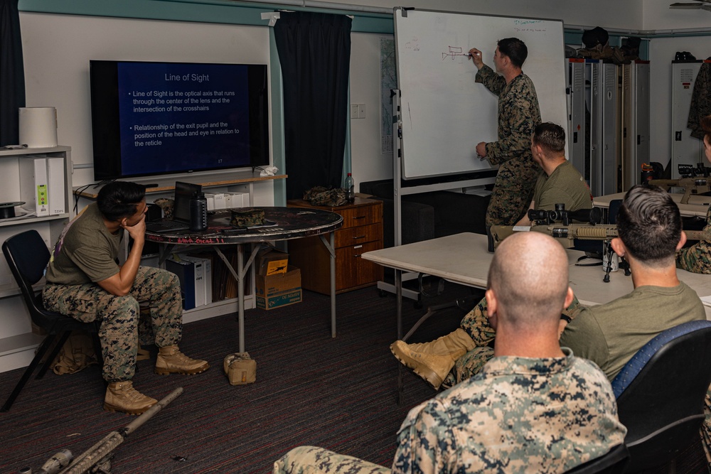 Marines with 2nd Bn., 5th Marines teach EOD technicians about M110 SASS