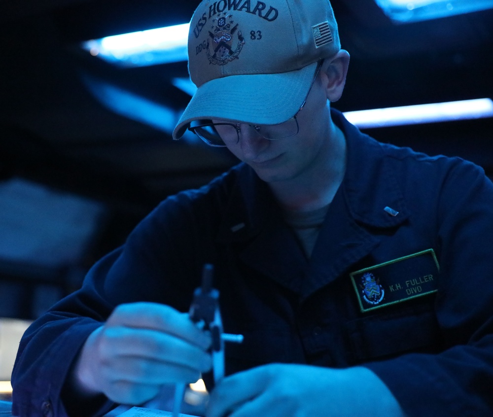 Sailors aboard the USS Howard conduct a live-fire exercise in the Philippine Sea