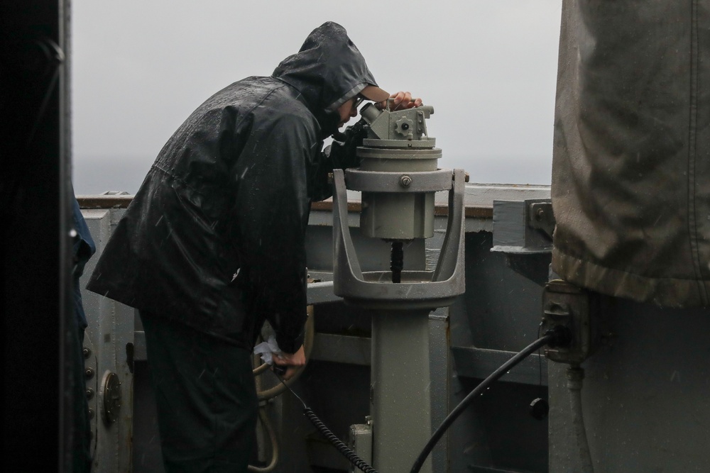 Sailors aboard the USS Howard conduct a sea and anchor detail in Okinawa, Japan