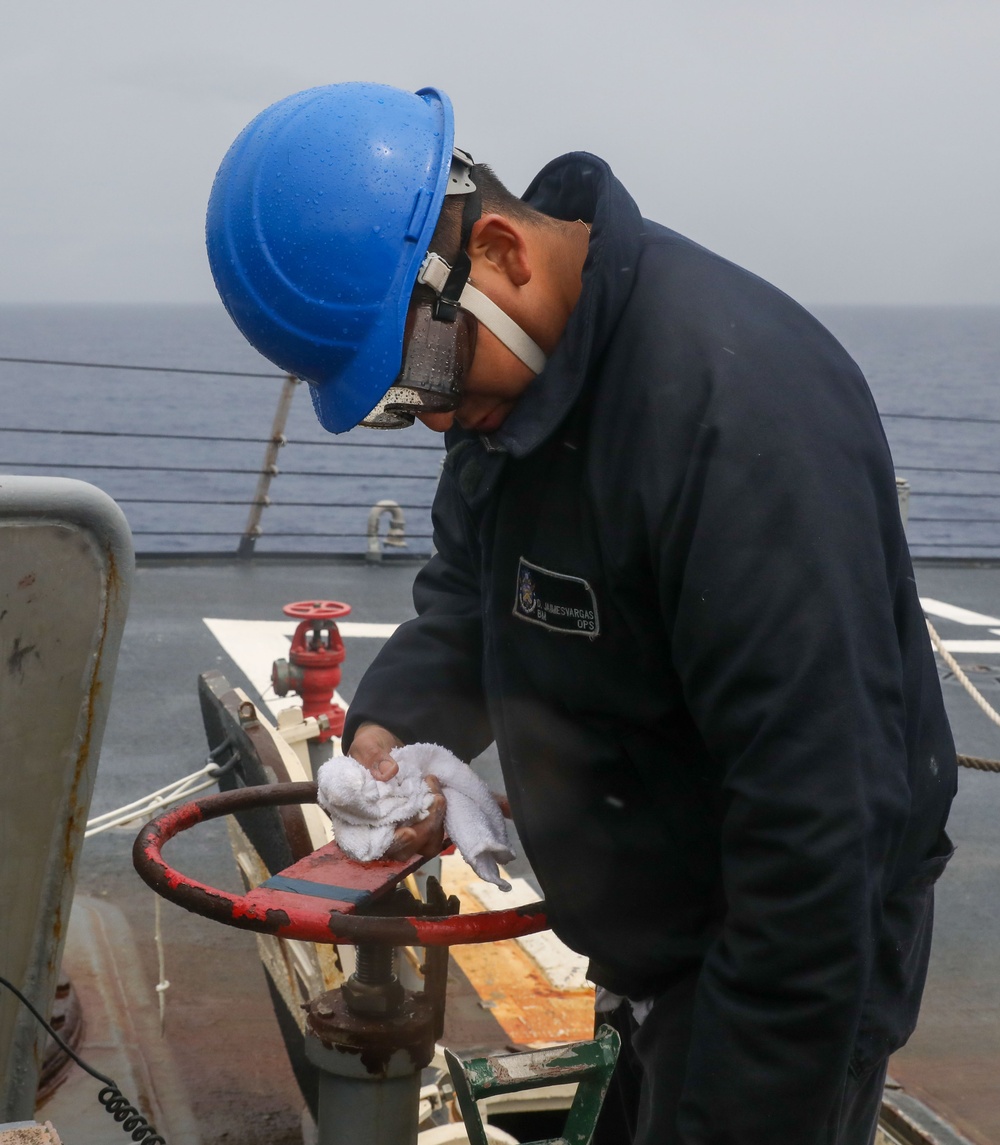 Sailors aboard the USS Howard conduct a sea and anchor detail in Okinawa, Japan