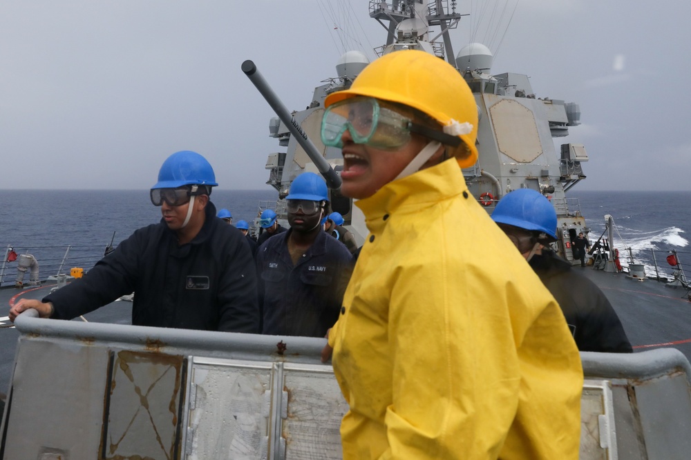 Sailors aboard the USS Howard conduct a sea and anchor detail in Okinawa, Japan