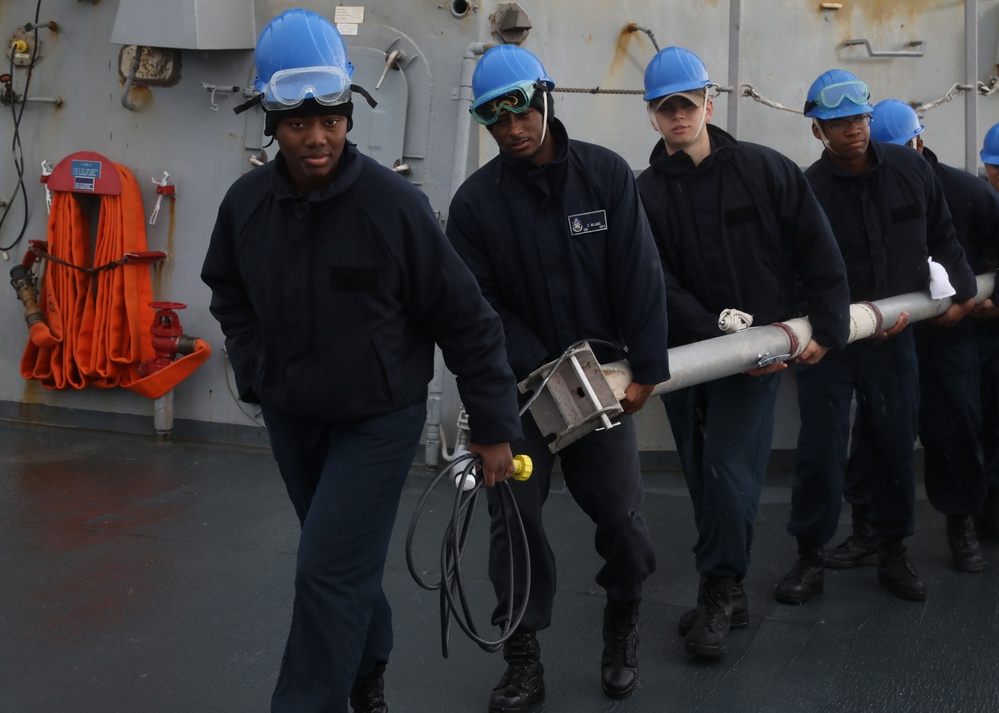 Sailors aboard the USS Howard conduct a sea and anchor detail in Okinawa, Japan