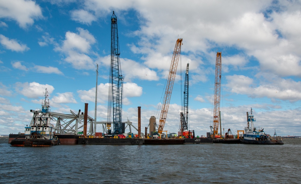 Crews work to clear wreckage from the Francis Scott Key Bridge