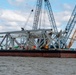 Crews work to clear wreckage from the Francis Scott Key Bridge