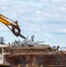 Crews work to clear wreckage from the Francis Scott Key Bridge