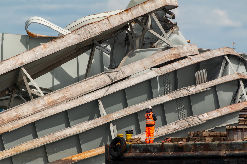 Crews work to clear wreckage from the Francis Scott Key Bridge