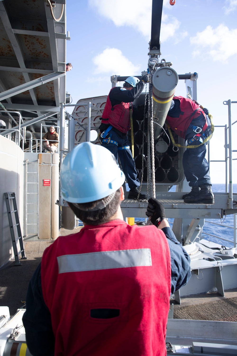 Sailors load a rolling airframe missile launcher