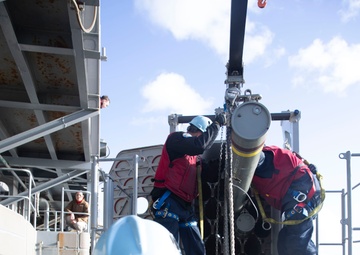 Sailors load a rolling airframe missile launcher