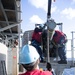 Sailors load a rolling airframe missile launcher