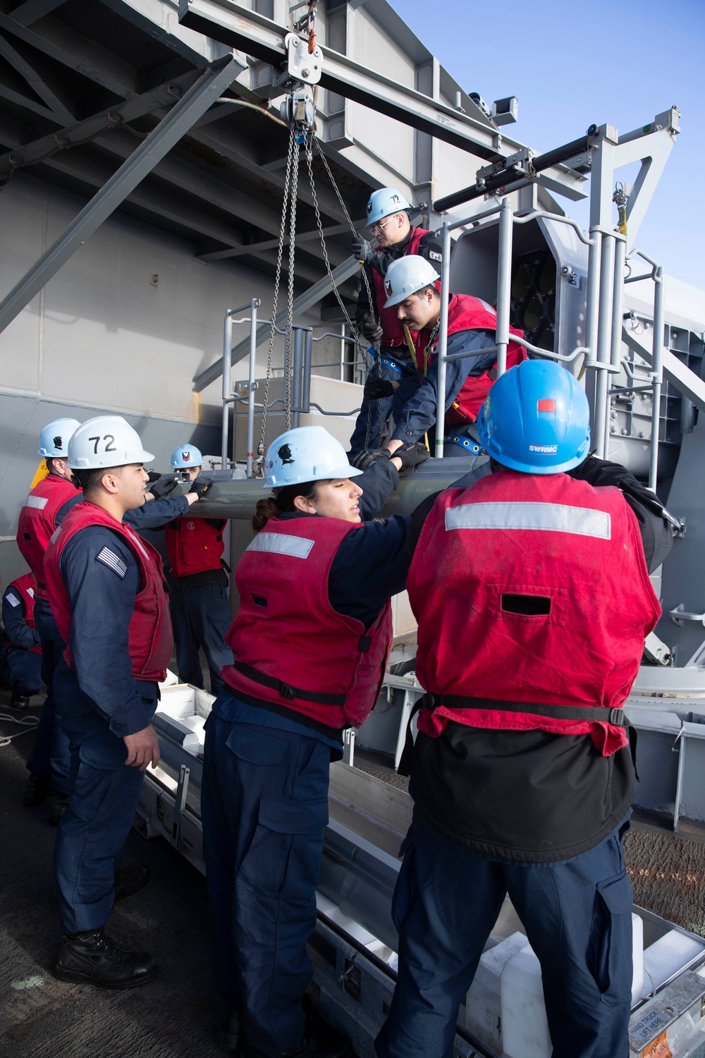 Sailors load a rolling airframe missile launcher