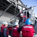 Sailors load a rolling airframe missile launcher