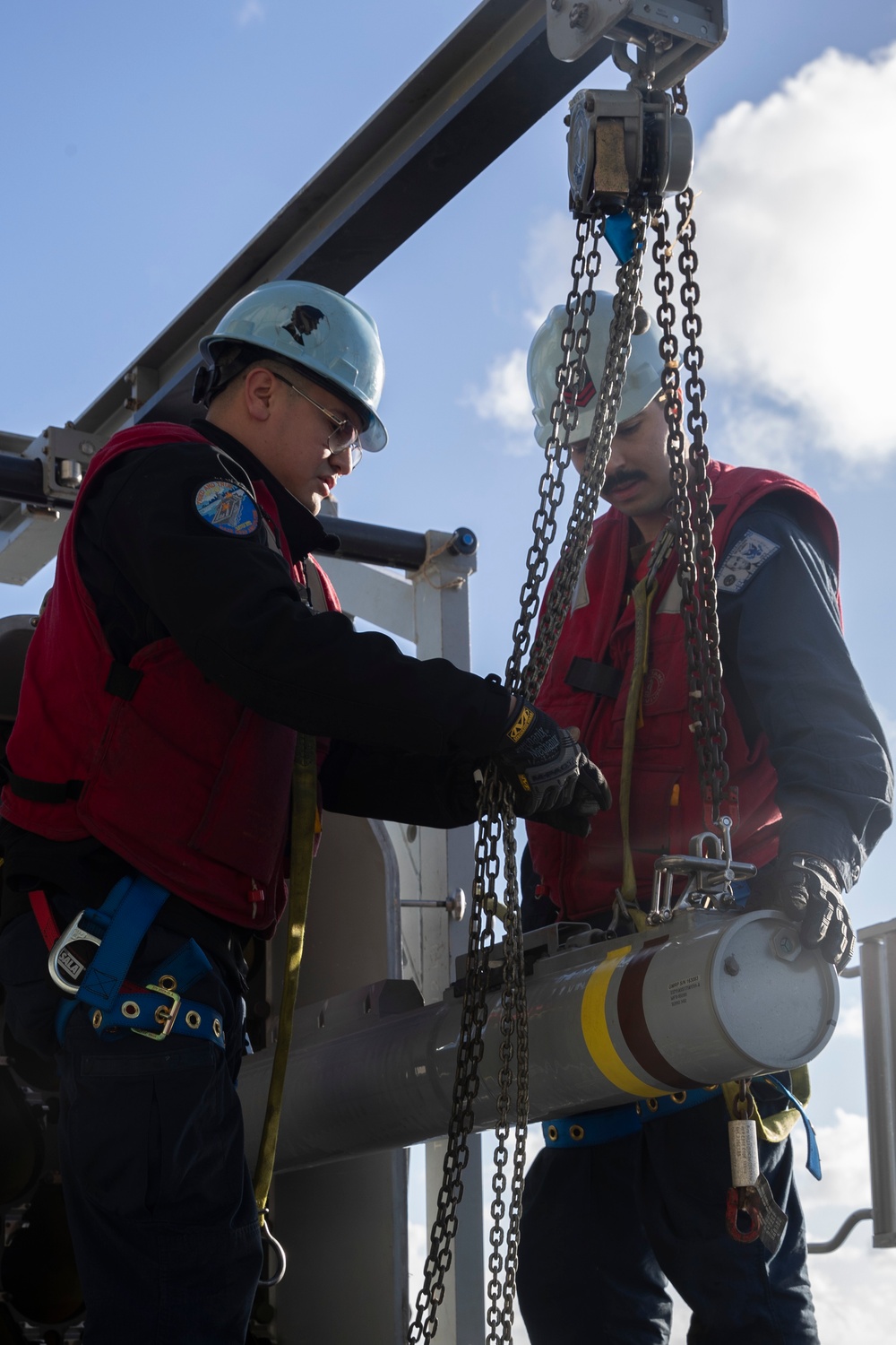Sailors load a rolling airframe missile launcher