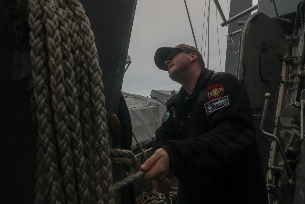 Sailors aboard the USS Howard conduct a replenishment-at-sea with USNS Yukon (T-AO-202) in the Philippine Sea