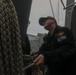 Sailors aboard the USS Howard conduct a replenishment-at-sea with USNS Yukon (T-AO-202) in the Philippine Sea