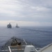 The USS Ralph Johnson conducts a replenishment-at-sea with USNS Yukon in the Philippine Sea