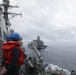 Sailors aboard the USS Howard conduct a replenishment-at-sea with USNS Yukon in the Philippine Sea