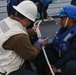 Sailors aboard the USS Howard conduct a replenishment-at-sea with USNS Yukon in the Philippine Sea