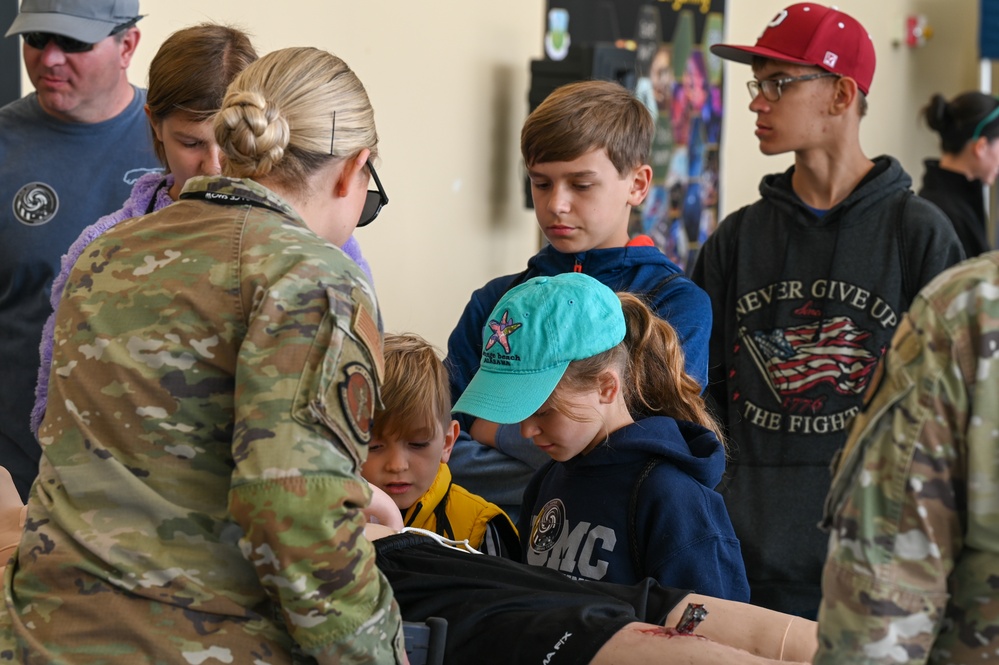 Medical group personnel demonstrate training mannequin