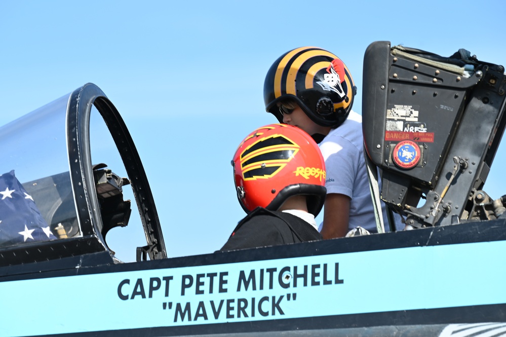 Air show spectators engage with static display