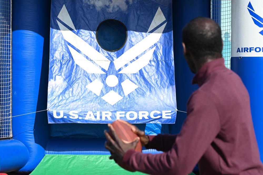 Air show spectator throws football during air show