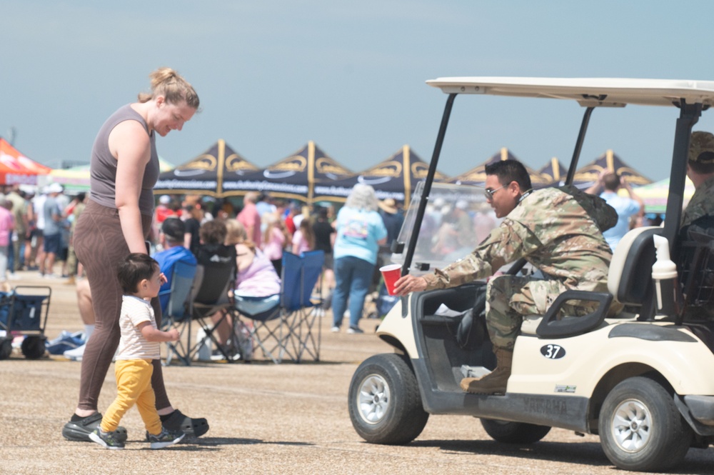 Airman gives child water