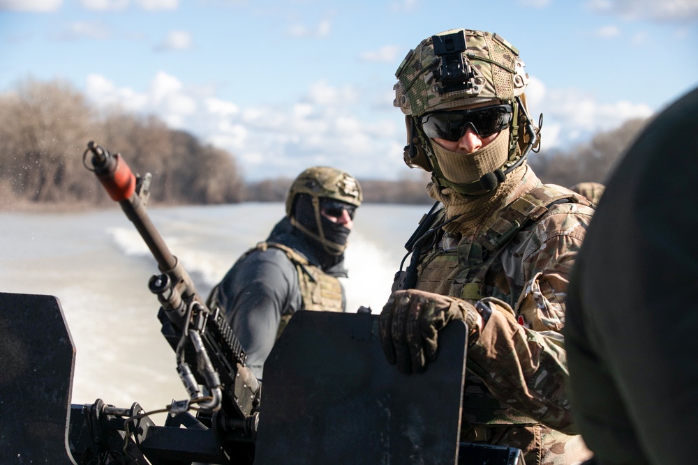 U.S. Navy Special Warfare Combat Crewmen and Hungarian special operations forces conduct riverine training during visit from distinguished visitors