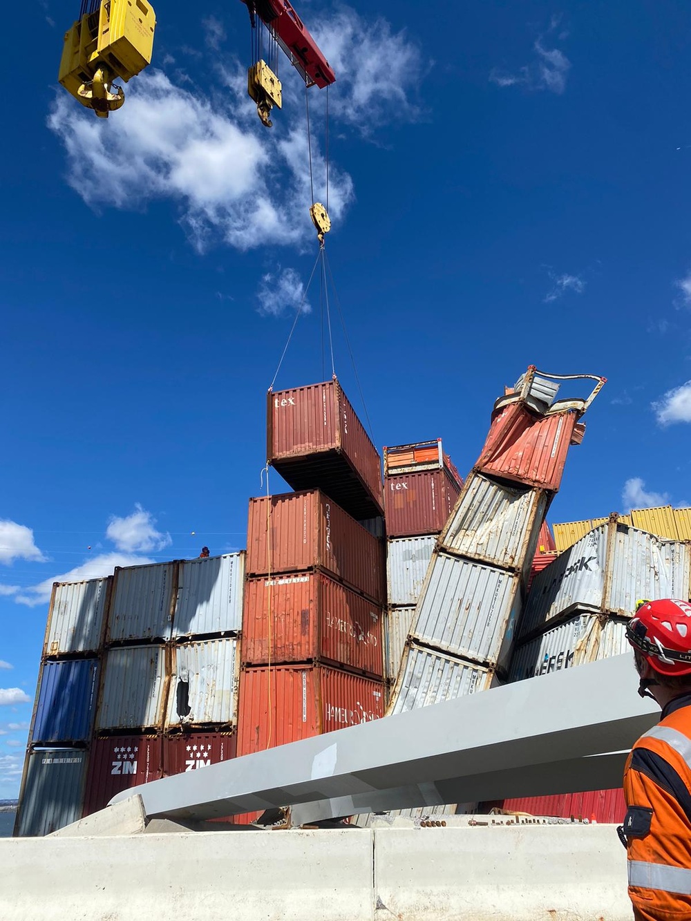 Containers being moved from bow of the MV Dali