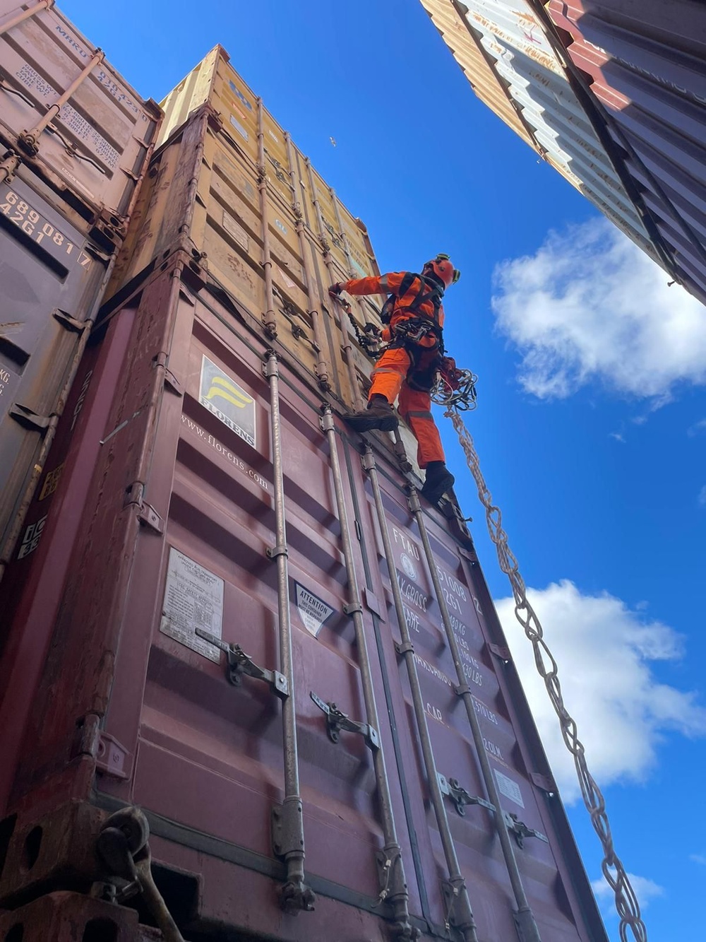 Containers being moved from bow of the MV Dali