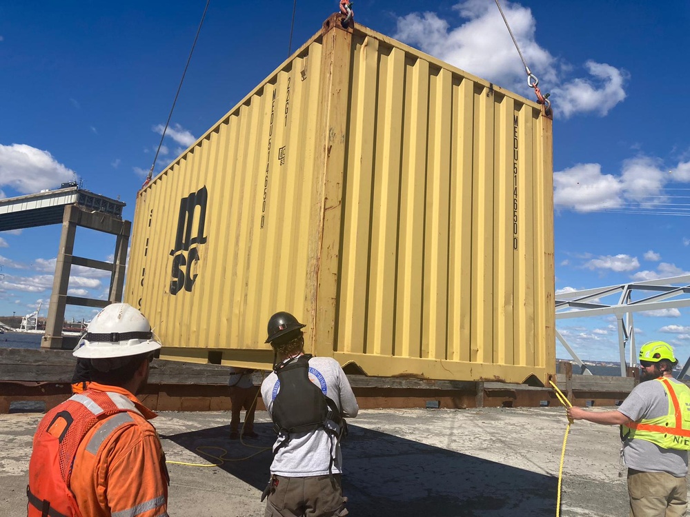 Containers being moved from bow of the MV Dali