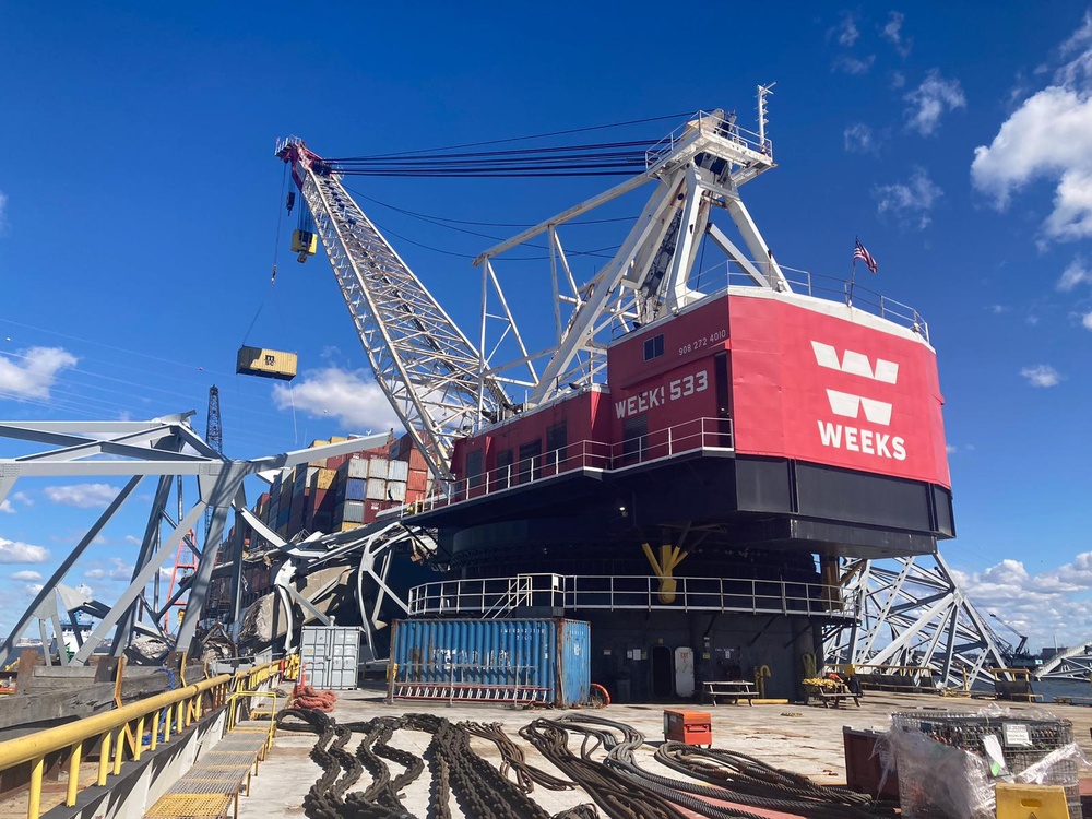 Containers being moved from bow of the MV Dali