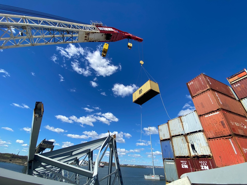 Containers being moved from bow of the MV Dali