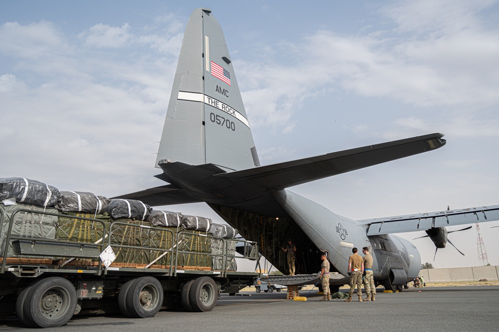 Airmen load AFCENT C-130s with humanitarian aid bound for Gaza